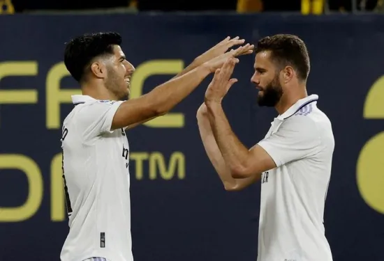 Nacho and Asensio score late to give Real Madrid 2-0 win at Cadiz