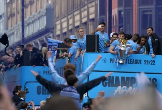 Manchester City dance in the rain to celebrate treble